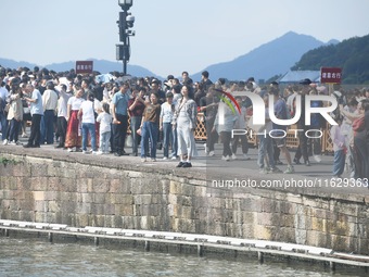 A large number of tourists visit the West Lake in Hangzhou, China, on October 2, 2024. (