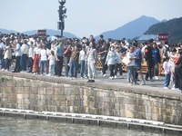 A large number of tourists visit the West Lake in Hangzhou, China, on October 2, 2024. (