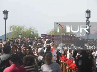 A large number of tourists visit the West Lake in Hangzhou, China, on October 2, 2024. (