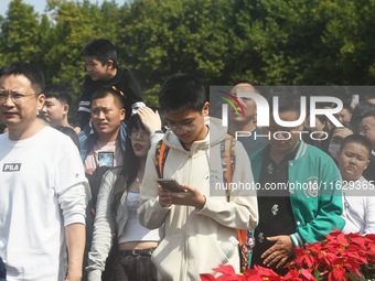 A large number of tourists visit the West Lake in Hangzhou, China, on October 2, 2024. (