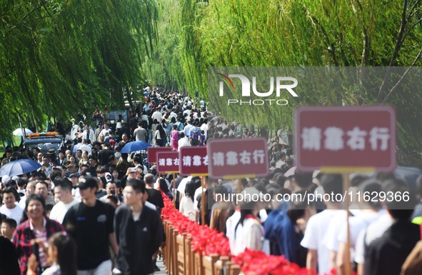 A large number of tourists visit the West Lake in Hangzhou, China, on October 2, 2024. 