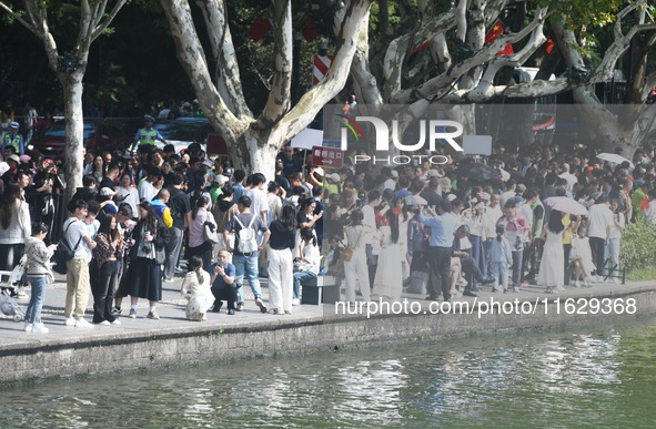 A large number of tourists visit the West Lake in Hangzhou, China, on October 2, 2024. 