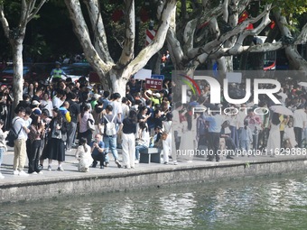 A large number of tourists visit the West Lake in Hangzhou, China, on October 2, 2024. (