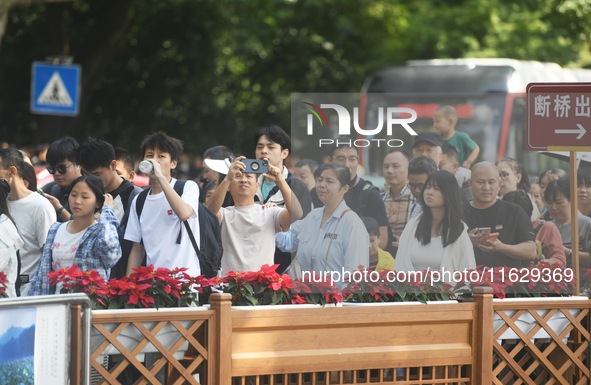 A large number of tourists visit the West Lake in Hangzhou, China, on October 2, 2024. 