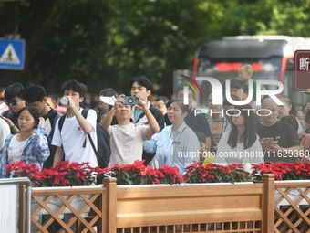 A large number of tourists visit the West Lake in Hangzhou, China, on October 2, 2024. (