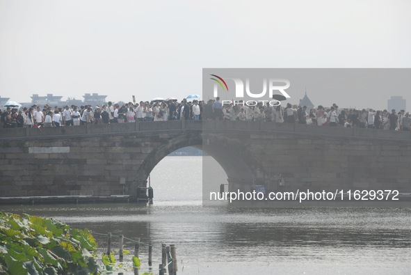 A large number of tourists visit the West Lake in Hangzhou, China, on October 2, 2024. 