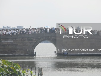 A large number of tourists visit the West Lake in Hangzhou, China, on October 2, 2024. (