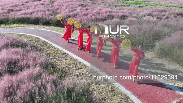 Tourists visit the sea of flowers in Lianyungang, China, on October 2, 2024. 