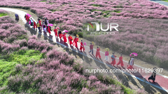 Tourists visit the sea of flowers in Lianyungang, China, on October 2, 2024. 