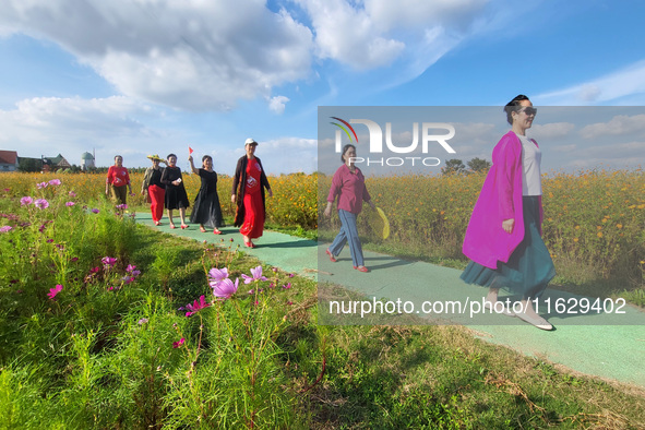 Tourists visit the sea of flowers in Lianyungang, China, on October 2, 2024. 