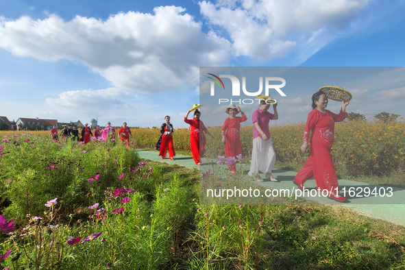 Tourists visit the sea of flowers in Lianyungang, China, on October 2, 2024. 