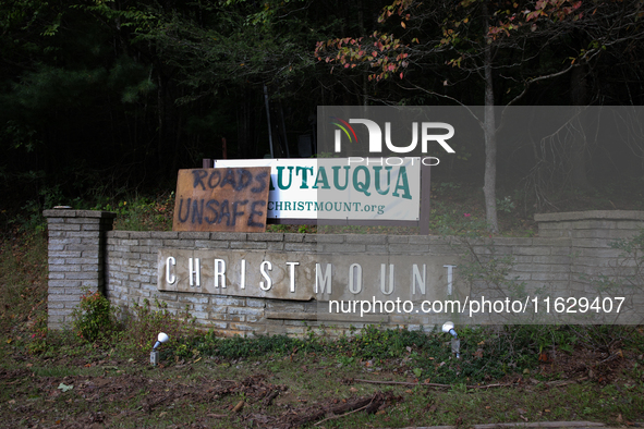 A sign directs drivers on a road in Asheville, North Carolina on October 1, 2024 after Hurricane Helene caused widespread damage to the regi...