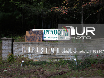 A sign directs drivers on a road in Asheville, North Carolina on October 1, 2024 after Hurricane Helene caused widespread damage to the regi...