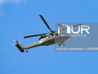 A U.S. Navy helicopter surveys damage from Hurricane Helene over Asheville, North Carolina on October 1, 2024. (