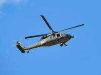 A U.S. Navy helicopter surveys damage from Hurricane Helene over Asheville, North Carolina on October 1, 2024. (