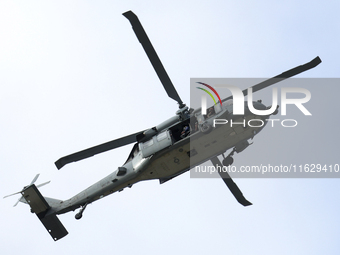 A U.S. Navy helicopter surveys damage from Hurricane Helene over Asheville, North Carolina on October 1, 2024. (