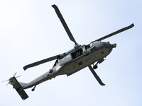 A U.S. Navy helicopter surveys damage from Hurricane Helene over Asheville, North Carolina on October 1, 2024. (