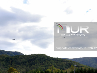 U.S. Navy helicopters survey damage from Hurricane Helene over Asheville, North Carolina on October 1, 2024. (