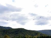 U.S. Navy helicopters survey damage from Hurricane Helene over Asheville, North Carolina on October 1, 2024. (