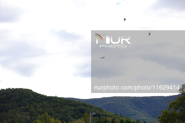 U.S. Navy helicopters survey damage from Hurricane Helene over Asheville, North Carolina on October 1, 2024. 