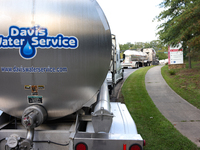 Water supply vehicles park near Mission Hospital in Asheville, North Carolina on October 1, 2024. (