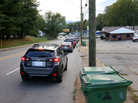 Vehicles wait in line for gasoline in Asheville, North Carolina on October 1, 2024 after Hurricane Helene caused widespread damage, cutting...