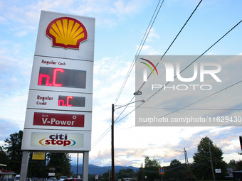 A gas station price sign in Asheville, North Carolina displays the initials of the state on October 1, 2024 after Hurricane Helene caused wi...