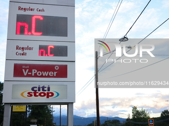 A gas station price sign in Asheville, North Carolina displays the initials of the state on October 1, 2024 after Hurricane Helene caused wi...