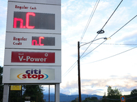 A gas station price sign in Asheville, North Carolina displays the initials of the state on October 1, 2024 after Hurricane Helene caused wi...