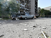 A car parks outside the residential high-rise damaged by Russian shelling in Zaporizhzhia, Ukraine, on October 1, 2024. NO USE RUSSIA. NO US...