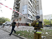 Rescuers are seen outside the residential high-rise damaged by Russian shelling in Zaporizhzhia, Ukraine, on October 1, 2024. NO USE RUSSIA....