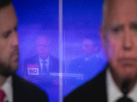 One television reflects another during a watch party at Madhatter for the Vice presidential debate between Demcocrat Gov. Tim Walz (D-MN) an...