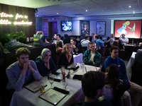 People attend a watch party at Madhatter for the Vice presidential debate between Demcocrat Gov. Tim Walz (D-MN) and Republican Sen. J.D. Va...