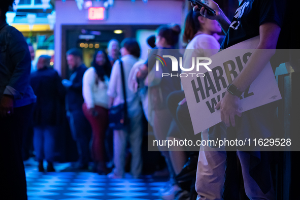 People attend a watch party at the Madhatter for the Vice presidential debate between Demcocrat Gov. Tim Walz (D-MN) and Republican Sen. J.D...