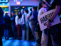 People attend a watch party at the Madhatter for the Vice presidential debate between Demcocrat Gov. Tim Walz (D-MN) and Republican Sen. J.D...