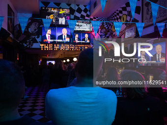 People attend a watch party at Madhatter for the Vice presidential debate between Demcocrat Gov. Tim Walz (D-MN) and Republican Sen. J.D. Va...