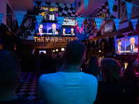 People attend a watch party at Madhatter for the Vice presidential debate between Demcocrat Gov. Tim Walz (D-MN) and Republican Sen. J.D. Va...