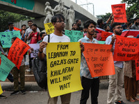 Students of the Faculty of Business Studies of Dhaka University (DU) stage a demonstration and rally against the insult of the Prophet Muham...