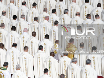 Priests and bishops attend a Holy Mass led by Pope Francis at the opening session of the 16th Ordinary General Assembly of the Synod of Bish...