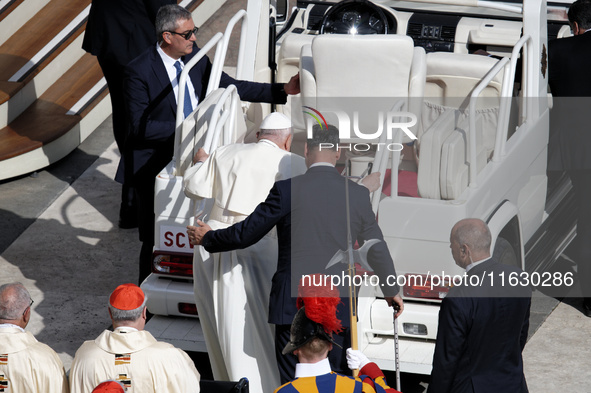 Pope Francis gets on the popemobile at the end of a mass for the opening of the Ordinary General Assembly of the Synod of Bishops in The Vat...