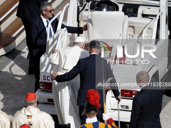 Pope Francis gets on the popemobile at the end of a mass for the opening of the Ordinary General Assembly of the Synod of Bishops in The Vat...