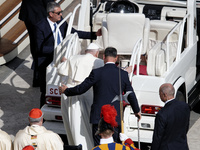 Pope Francis gets on the popemobile at the end of a mass for the opening of the Ordinary General Assembly of the Synod of Bishops in The Vat...