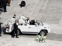 Pope Francis greets the crowd at the end of a mass for the opening of the Ordinary General Assembly of the Synod of Bishops in The Vatican,...