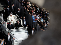 Pope Francis greets the crowd at the end of a mass for the opening of the Ordinary General Assembly of the Synod of Bishops in The Vatican,...