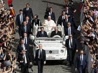 Pope Francis greets the crowd at the end of a mass for the opening of the Ordinary General Assembly of the Synod of Bishops in The Vatican,...