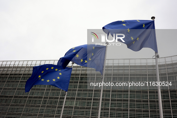 EU flags wave outside the European Commission building in Brussels, Belgium, on September 30, 2024. 