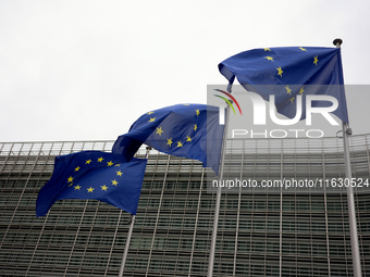 EU flags wave outside the European Commission building in Brussels, Belgium, on September 30, 2024. (