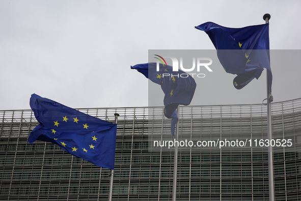 EU flags wave outside the European Commission building in Brussels, Belgium, on September 30, 2024. 