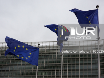 EU flags wave outside the European Commission building in Brussels, Belgium, on September 30, 2024. (