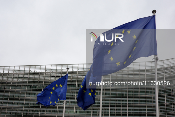 EU flags wave outside the European Commission building in Brussels, Belgium, on September 30, 2024. 